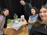 Professor taraneh Saneih and student around the traditional table