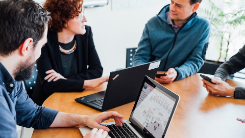 Staff members at a meeting