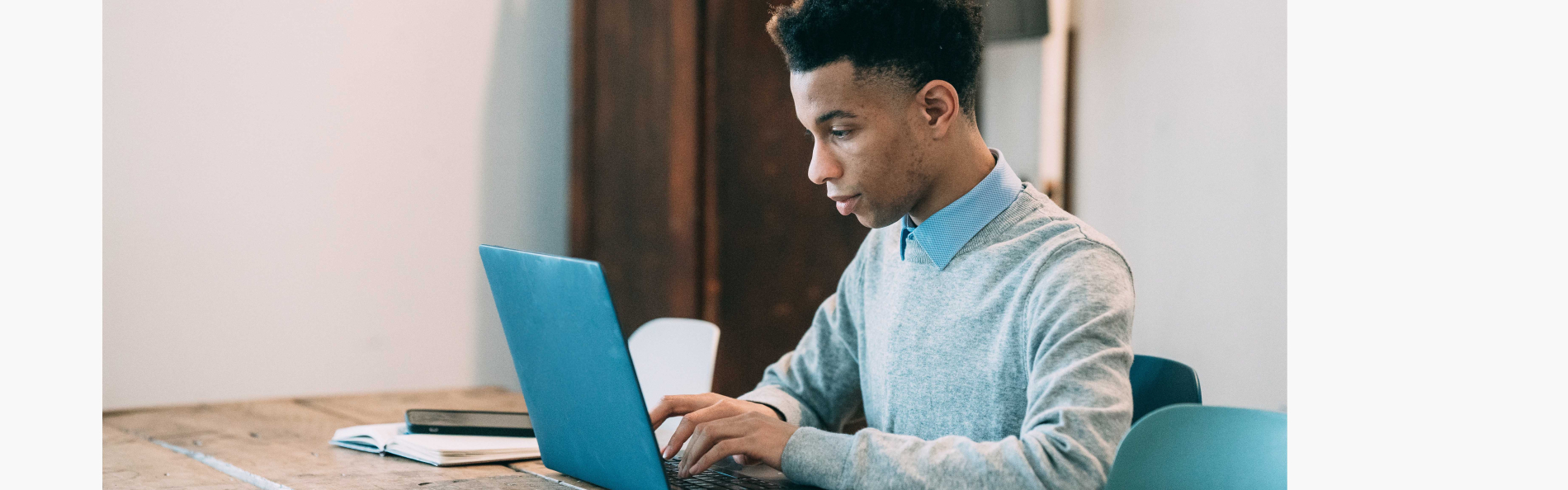 Person sitting at laptop computer