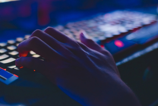 image of hand on computer keyboard