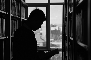 silhouette of man at library