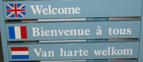 English, French, Dutch Welcome sign