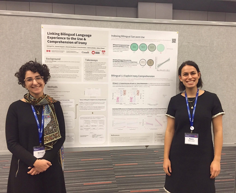 Mehrgol Tiv and Naomi Vingron presenting a poster