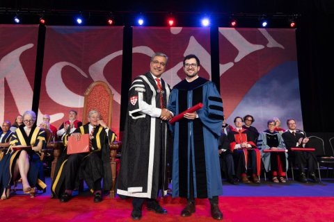 McGill Principal Deep Saini presenting an award to Professor Ignacio Cofone at Convocation