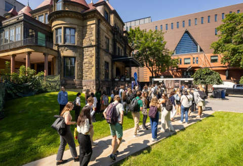 New students walking the path towards the McGill Law building and library