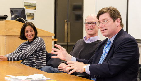 Faculty members in conversation