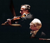 2 men playing instruments
