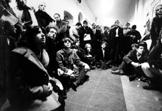 Students watching television debate between Principal H. Rocke Robertson, Dean of Arts H. Wood, and Stanley Gray,1969. MUA PR000406
