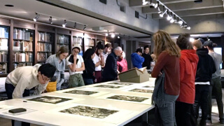 Visitors looking at rare items