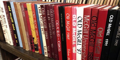 Old McGill Yearbooks on a book cart.