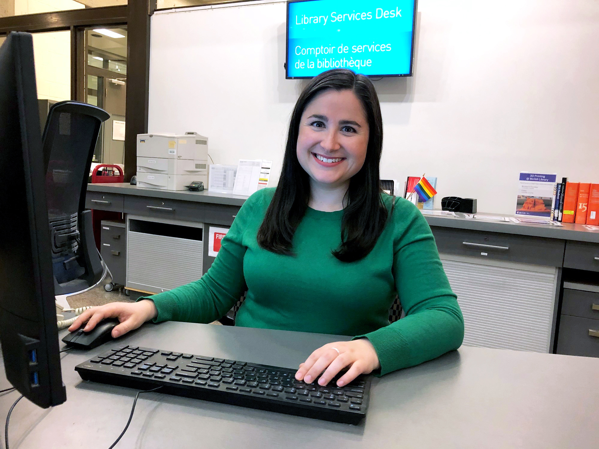 Librarian at the Library Services desk