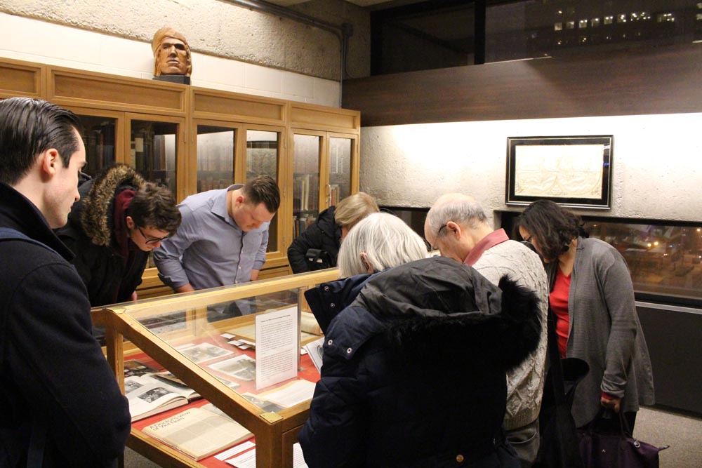 guests looking at archival display
