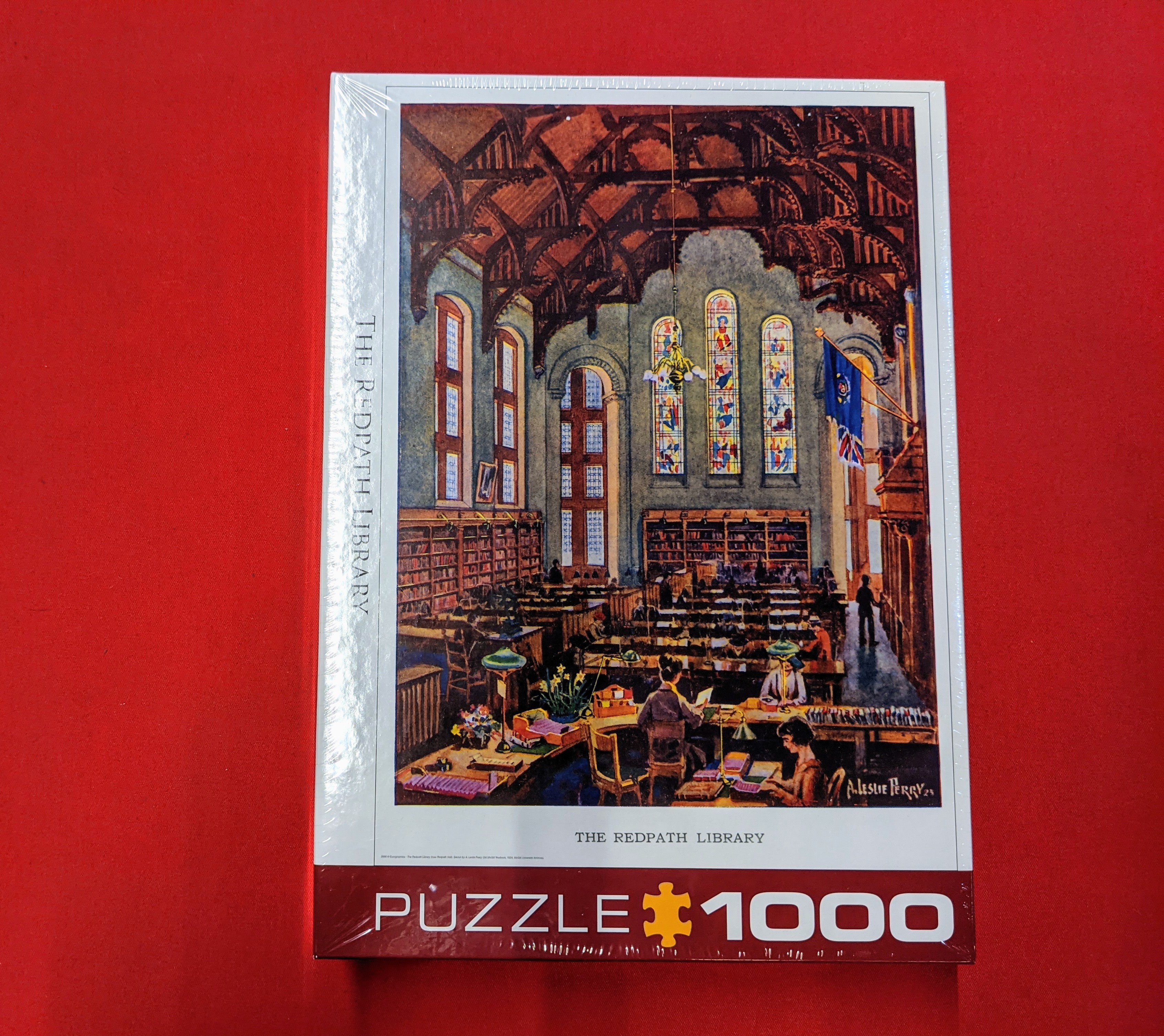puzzle with an image of redpath library on the box against a red background