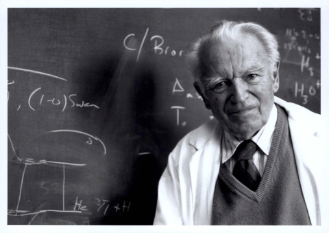 German-Canadian scientist Gerhard Herzberg in front of a blackboard