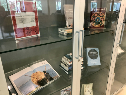 Installation view of exhibition featuring close-ups of books.