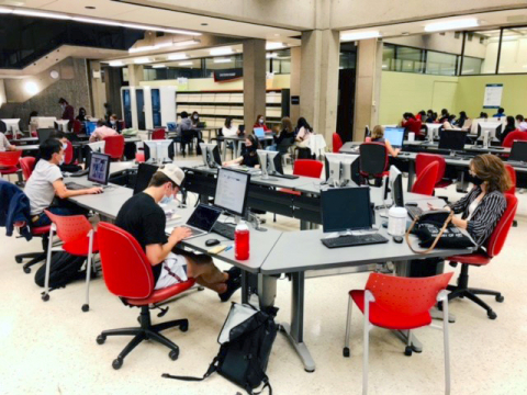 Students working in the McLennan reference area, main floor, McLennan Library Building.