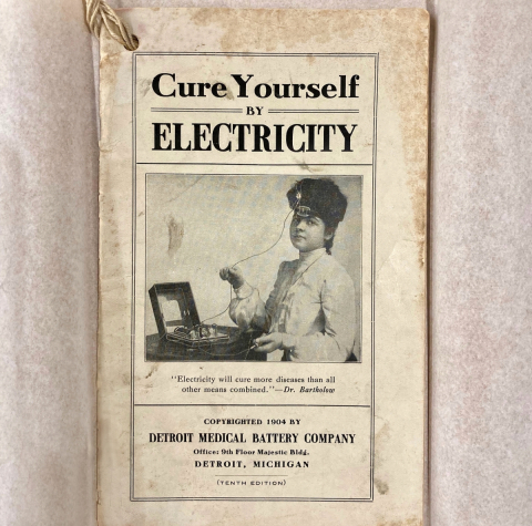 cure yourself by electricity above a women with an electrical device wired to her head