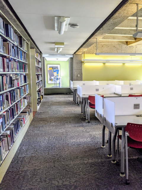 Sixth floor of the McLennan Library Building featuring carrel, stacks and standing desks.