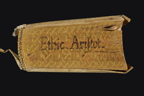 Close-up of rare book against a black background