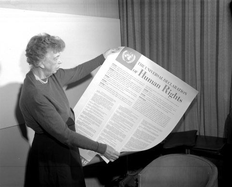 Eleanor Roosevelt holding poster of the Universal Declaration of Human Rights (in English), Lake Success, New York. November 1949.