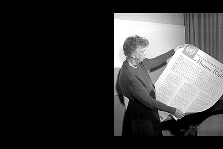 Graphic featuring black box and photo of woman looking at the Declaration of Human Rights