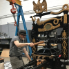 George Walker pulling the print lever on the McGill Columbian Press in the Howard Iron Works studio