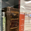 Installation view of exhibition featuring close-ups of books.