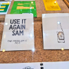 exhibition items on display reading ; use it again sam