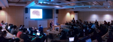 An panorama of a lecture room with the Ludmer logo on the projection screen