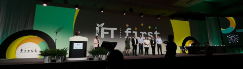 Students accept their award onstage at the 2023 IFT First event