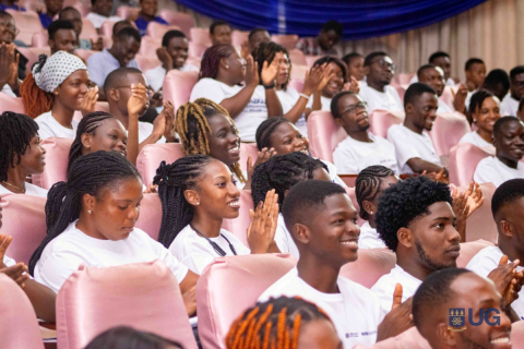 Ghanaian students in a lecture hall clapping