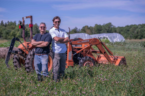 Joe (left) and Andrew Harrel working the fields of Fairweather Farm.