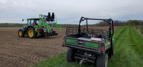 two tractors in a farm field