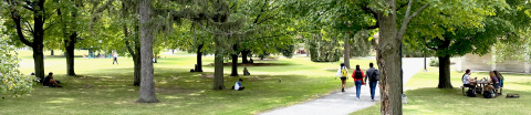 students walking through Mac Campus on a summer day