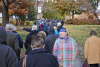 A large crowd walking outside in Fall