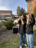 Two John Abbott College Space Club Executives look up at the sky through protective lenses. (Credit: John Abbott College Space Club)