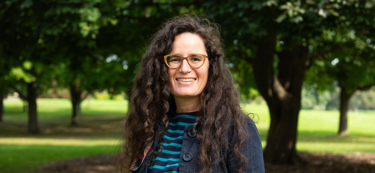 Elsa Vasseur smiling outside with trees in background