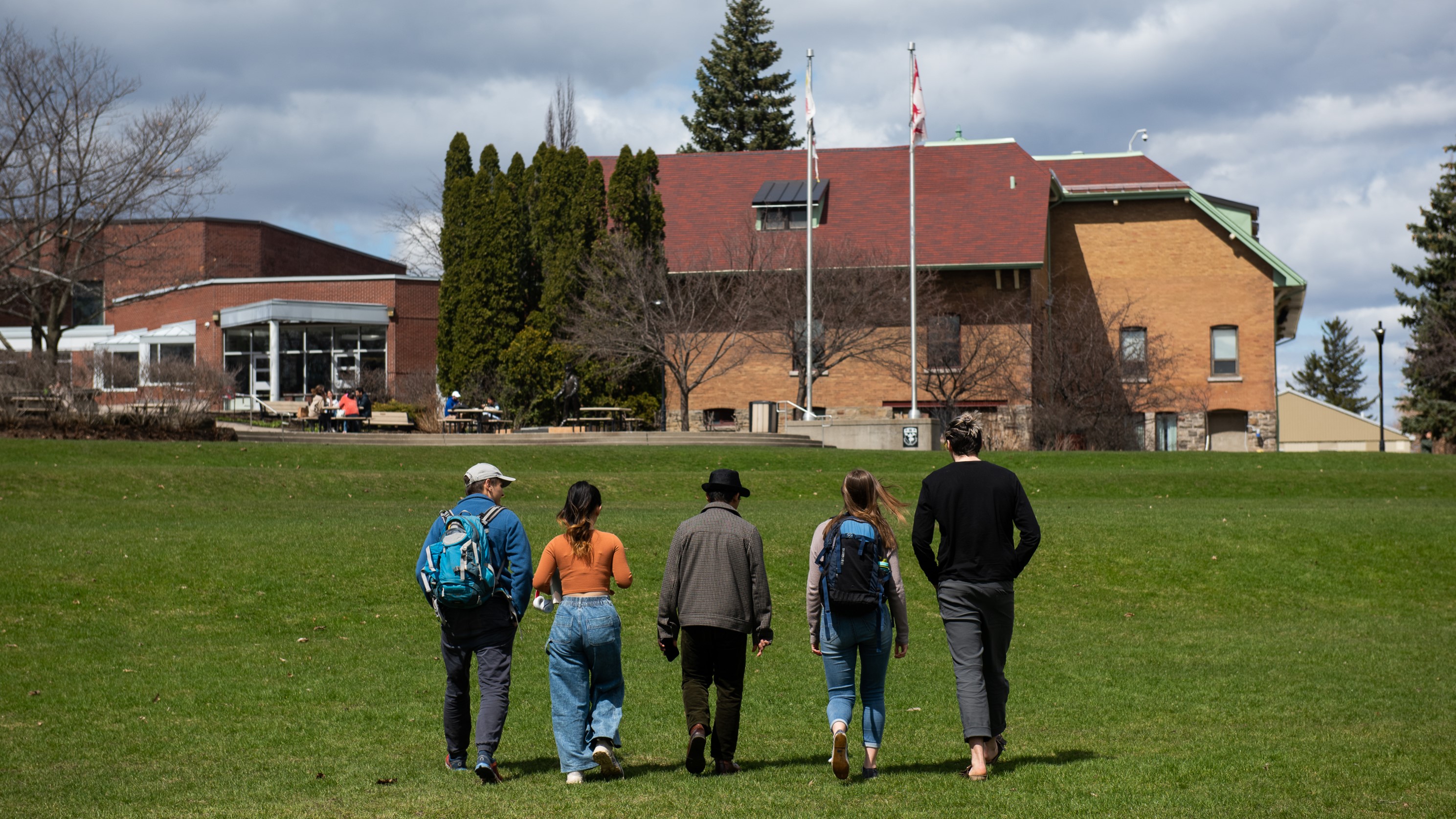 Students outside walking up to the Macdonald Stewart building