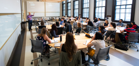 Professor teaching a class filled with students