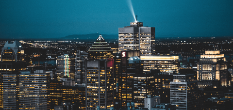 Skyline of Montreal at Night with a beacon light