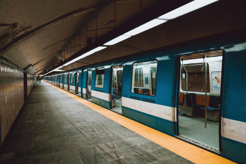 A near-empty Montreal Metro train arrives at a station