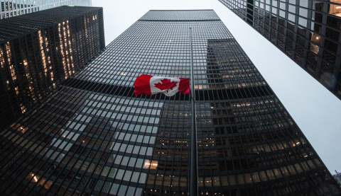 A Canadian flag in downtown Toronto flies at half mast