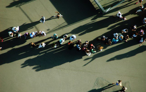 top view of a crowd in a empty cement roaad
