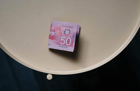 $50 Canadian bills on a table