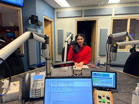 photo of Shweta Menon in the CBC Radio recording studio recording a podcast