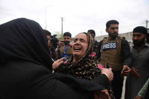 A Sikh woman in Afghanistan weeps following an attack on religious minorities in Afghanistan