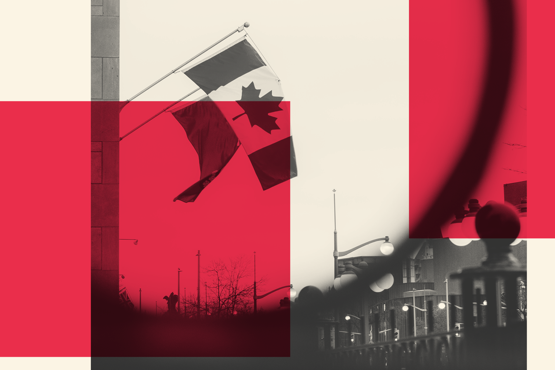 A Canadian flag flies above a street