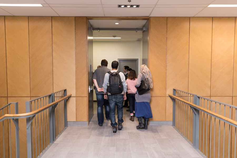 Alfred Jaeger, Academic Director, MBA &amp; PMBA, giving a building tour to a group of MBA students.