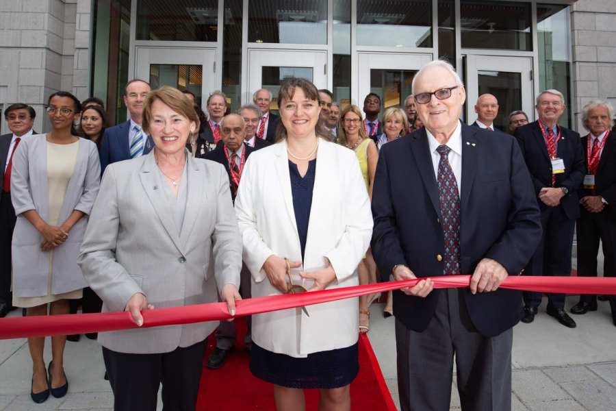 Donors observe Principal and Vice-Chancellor, Suzanne Fortier, Dean Isabelle Bajeux, and Marcel Desautels (C.M., LLD’07) cut the ribbon in front of the new Donald E. Armstrong Building on May 25.