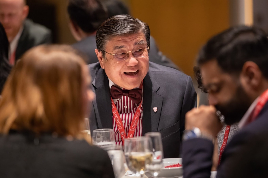Henry H.S. Lam (BCom’78) enjoys the conversation at the table.
